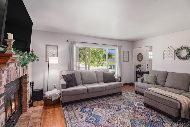 7440 Grandwood Dr, Swartz Creek, MI 48473 - living area featuring wood finished floors and a fireplace