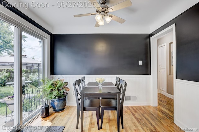 2861 Sunnyknoll Ave, Berkley, MI 48072 - dining room with a wainscoted wall, wood finished floors, and ceiling fan