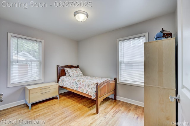 2861 Sunnyknoll Ave, Berkley, MI 48072 - bedroom with light wood-style flooring and baseboards