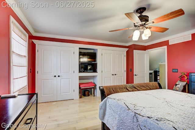 2861 Sunnyknoll Ave, Berkley, MI 48072 - bedroom with crown molding, two closets, light wood-type flooring, and ceiling fan
