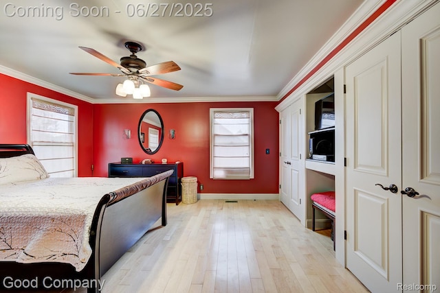 2861 Sunnyknoll Ave, Berkley, MI 48072 - bedroom with crown molding, light wood-type flooring, and ceiling fan