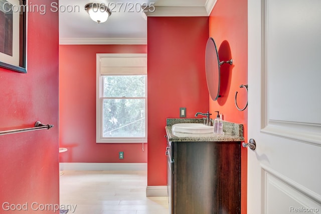 2861 Sunnyknoll Ave, Berkley, MI 48072 - bathroom featuring ornamental molding, vanity, and wood finished floors
