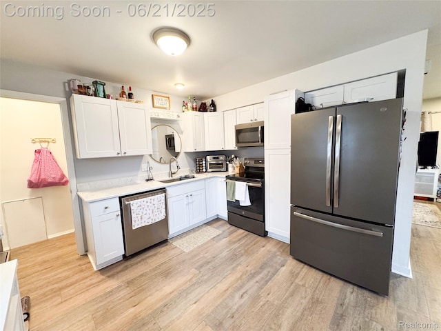 474 Argyle Cres, Milan, MI 48160 - kitchen with appliances with stainless steel finishes, light wood-type flooring, and light countertops