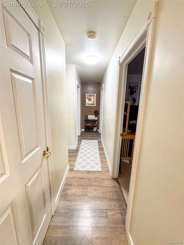 474 Argyle Cres, Milan, MI 48160 - corridor featuring light wood finished floors and baseboards