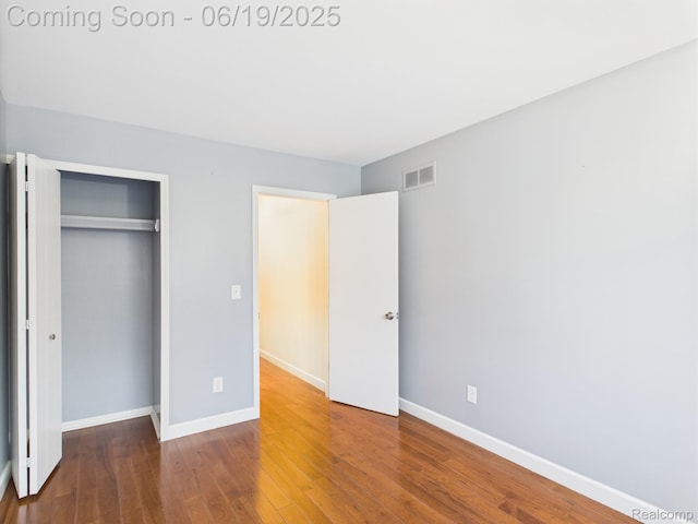 38772 Windmill Pointe N, Clinton Township, MI 48038 - unfurnished bedroom featuring a closet and wood finished floors