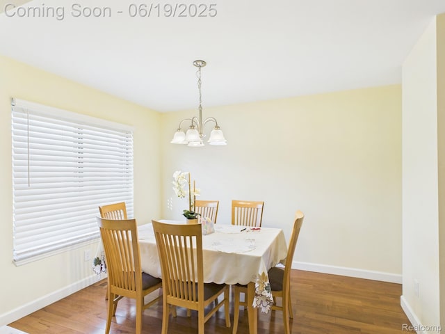 38772 Windmill Pointe N, Clinton Township, MI 48038 - dining area featuring a chandelier and wood finished floors