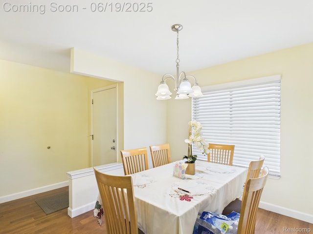 38772 Windmill Pointe N, Clinton Township, MI 48038 - dining area with a chandelier and wood finished floors
