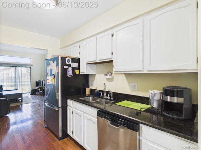 38772 Windmill Pointe N, Clinton Township, MI 48038 - kitchen with appliances with stainless steel finishes, white cabinets, dark stone countertops, and dark wood-style flooring