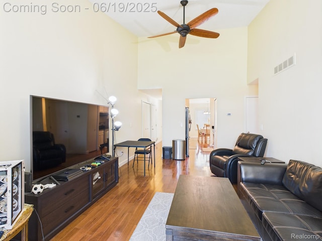 38772 Windmill Pointe N, Clinton Township, MI 48038 - living room featuring high vaulted ceiling, a ceiling fan, and wood finished floors