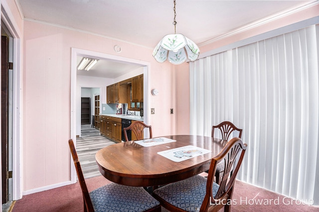 1124 Kusterer Dr NW, Grand Rapids, MI 49534 - dining area with light colored carpet and ornamental molding