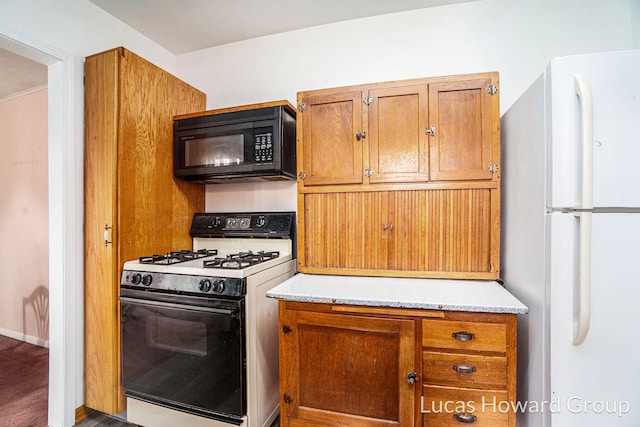 1124 Kusterer Dr NW, Grand Rapids, MI 49534 - kitchen featuring white appliances, brown cabinets, and light countertops