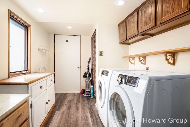 1124 Kusterer Dr NW, Grand Rapids, MI 49534 - laundry area featuring independent washer and dryer, cabinet space, dark wood-style floors, and recessed lighting