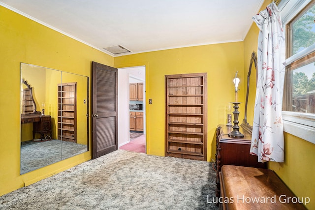 1124 Kusterer Dr NW, Grand Rapids, MI 49534 - carpeted bedroom featuring a closet and ornamental molding