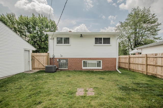 1361 Holmes Rd, Ypsilanti, MI 48198 - back of house featuring a gate and brick siding