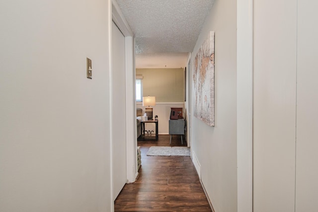 1361 Holmes Rd, Ypsilanti, MI 48198 - hallway with a textured ceiling and dark wood-type flooring