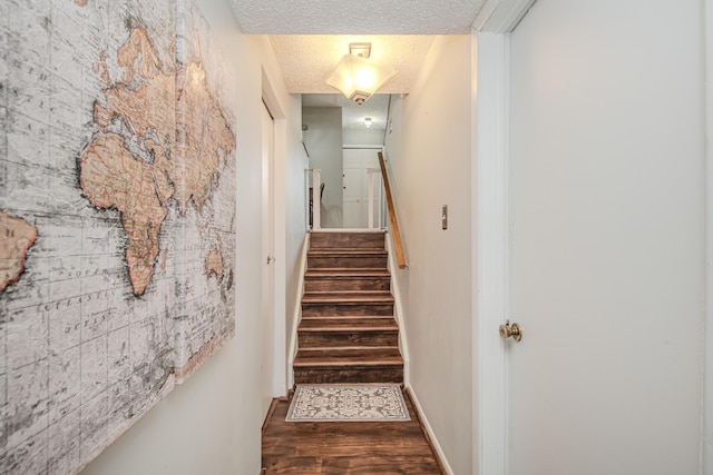 1361 Holmes Rd, Ypsilanti, MI 48198 - staircase featuring a textured ceiling and wood finished floors
