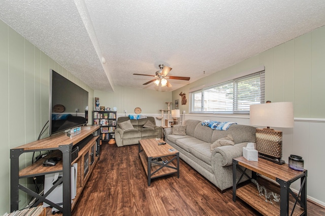 1361 Holmes Rd, Ypsilanti, MI 48198 - living area featuring a textured ceiling, dark wood-style flooring, ceiling fan, and a decorative wall