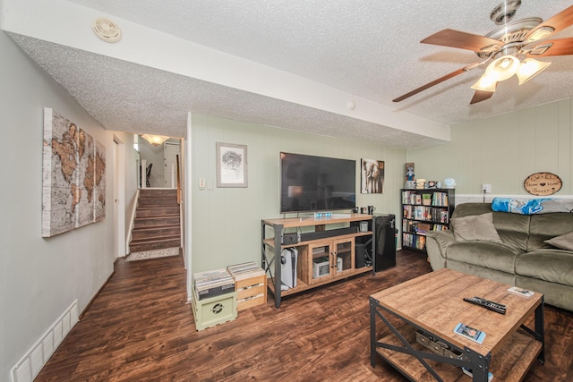 1361 Holmes Rd, Ypsilanti, MI 48198 - living area featuring a textured ceiling, wood finished floors, stairway, and a ceiling fan