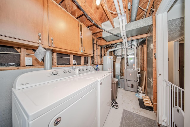 1361 Holmes Rd, Ypsilanti, MI 48198 - washroom featuring washer and dryer, water heater, heating unit, and cabinet space