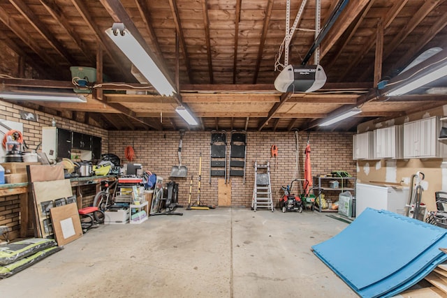 1361 Holmes Rd, Ypsilanti, MI 48198 - garage with a garage door opener and a workshop area