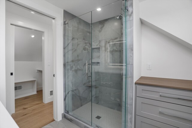 7280 Austin Rd, Saline, MI 48176 - full bath featuring a marble finish shower, wood finished floors, and recessed lighting