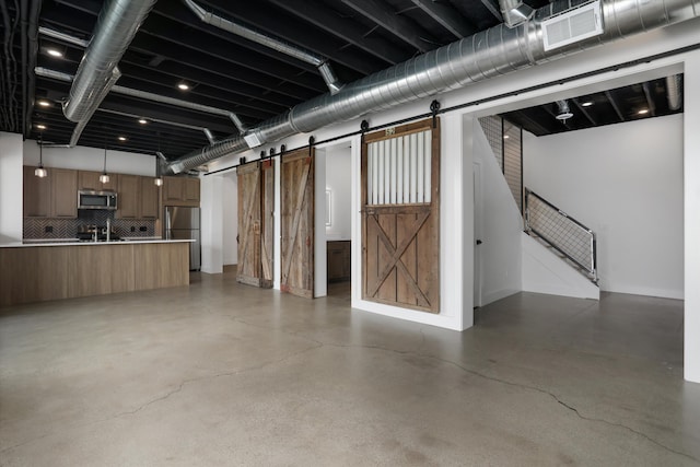7280 Austin Rd, Saline, MI 48176 - basement with a barn door and freestanding refrigerator