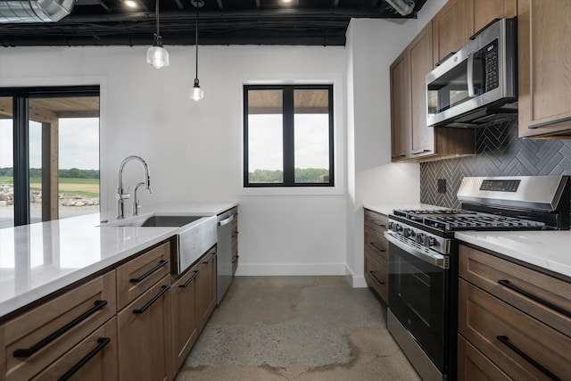 7280 Austin Rd, Saline, MI 48176 - kitchen with stainless steel appliances, plenty of natural light, backsplash, and light countertops