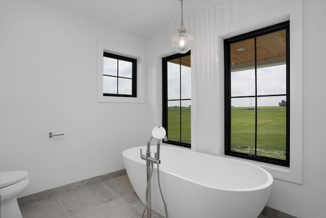 7280 Austin Rd, Saline, MI 48176 - full bath featuring baseboards and a freestanding tub