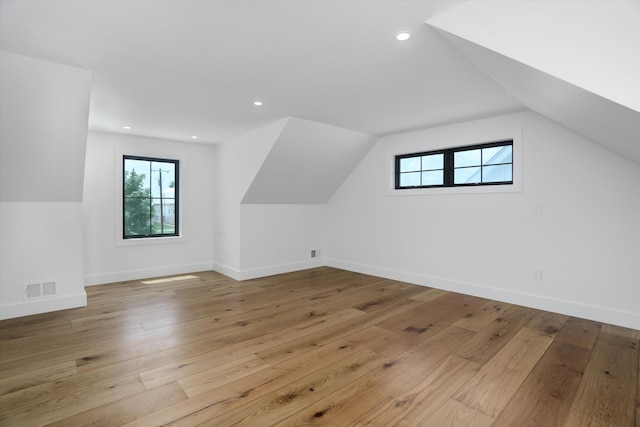 7280 Austin Rd, Saline, MI 48176 - additional living space featuring hardwood / wood-style floors, vaulted ceiling, and recessed lighting