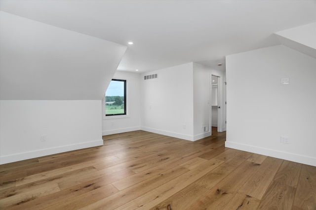 7280 Austin Rd, Saline, MI 48176 - bonus room featuring light wood-type flooring, recessed lighting, and vaulted ceiling