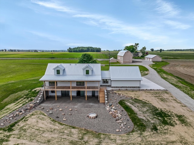 7280 Austin Rd, Saline, MI 48176 - view of front of home featuring an outbuilding, a metal roof, driveway, a barn, and a view of rural / pastoral area