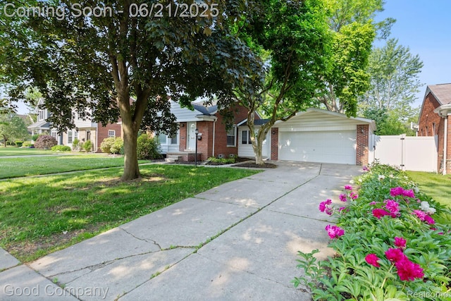 3603 Dukeshire Hwy, Royal Oak, MI 48073 - obstructed view of property with brick siding, an attached garage, and driveway