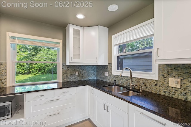 3603 Dukeshire Hwy, Royal Oak, MI 48073 - kitchen featuring dark stone counters, white cabinets, stainless steel microwave, and recessed lighting