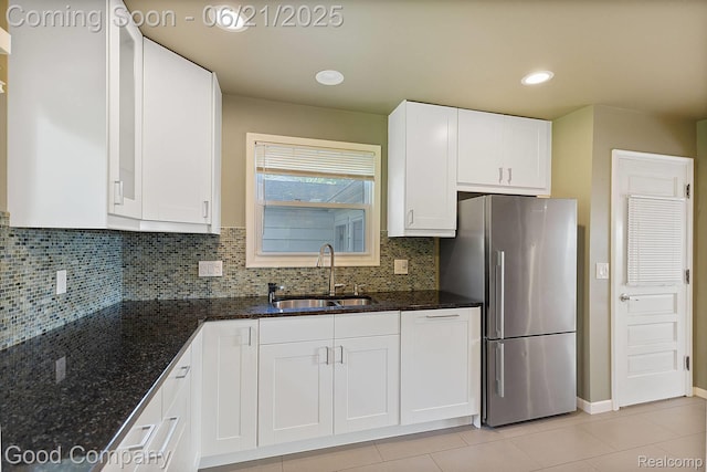 3603 Dukeshire Hwy, Royal Oak, MI 48073 - kitchen featuring freestanding refrigerator, white cabinetry, decorative backsplash, dark stone counters, and recessed lighting