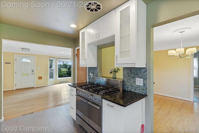 3603 Dukeshire Hwy, Royal Oak, MI 48073 - kitchen with high end stove, a chandelier, tasteful backsplash, white cabinets, and recessed lighting