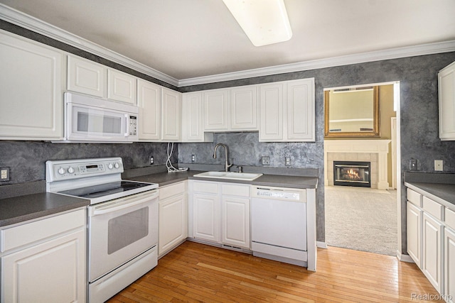 6438 Club Ct W, Grand Blanc, MI 48439 - kitchen featuring white appliances, dark countertops, white cabinetry, light wood finished floors, and ornamental molding