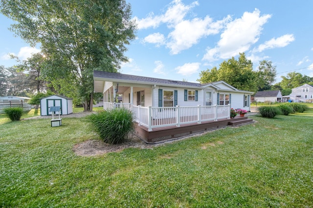 3280 Carlton Blvd, Jackson, MI 49203 - view of front of property featuring a storage unit, a front yard, and a deck