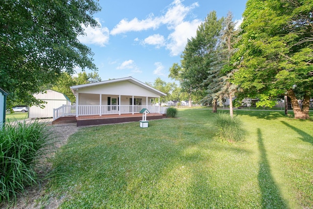 3280 Carlton Blvd, Jackson, MI 49203 - view of grassy yard featuring a porch and a shed