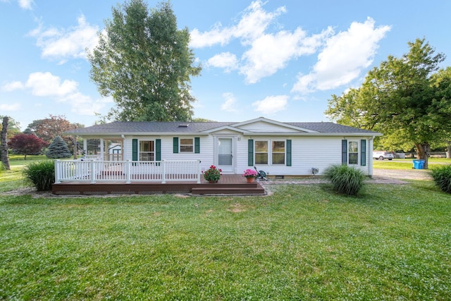 3280 Carlton Blvd, Jackson, MI 49203 - rear view of house with a deck, a yard, and roof with shingles