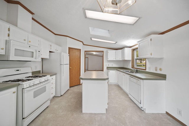 3280 Carlton Blvd, Jackson, MI 49203 - kitchen featuring white appliances, lofted ceiling, a kitchen island, white cabinets, and crown molding