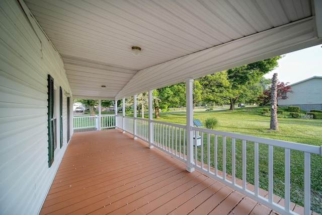 3280 Carlton Blvd, Jackson, MI 49203 - wooden porch featuring a lawn
