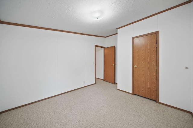 3280 Carlton Blvd, Jackson, MI 49203 - unfurnished bedroom with crown molding, a textured ceiling, and carpet floors