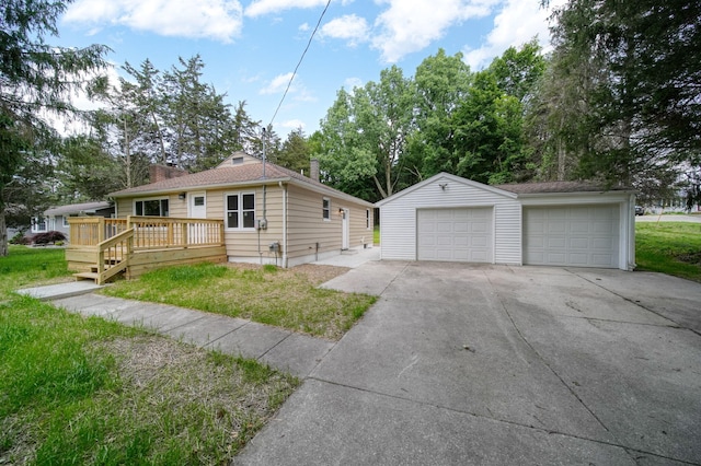 10620 Cady Rd, Jackson, MI 49201 - view of front of property with a garage, a wooden deck, an outbuilding, a chimney, and a front lawn