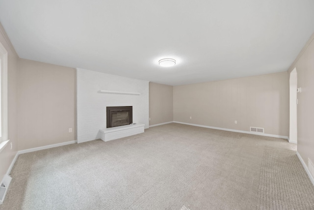 10620 Cady Rd, Jackson, MI 49201 - unfurnished living room featuring carpet floors and a brick fireplace