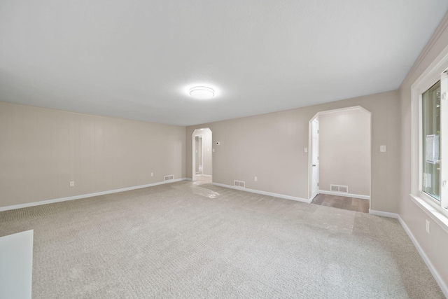 10620 Cady Rd, Jackson, MI 49201 - carpeted spare room with arched walkways and baseboards