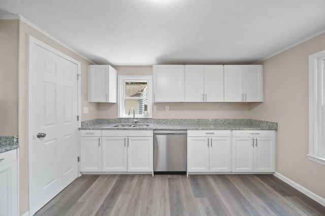 10620 Cady Rd, Jackson, MI 49201 - kitchen featuring stainless steel dishwasher, light wood-type flooring, white cabinetry, ornamental molding, and light stone countertops