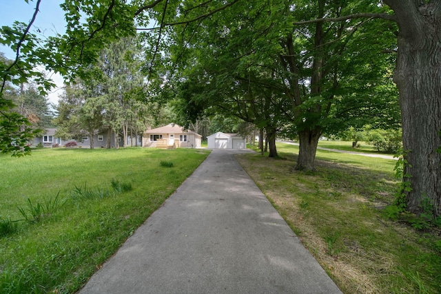10620 Cady Rd, Jackson, MI 49201 - view of front facade with a garage, an outbuilding, and a front yard