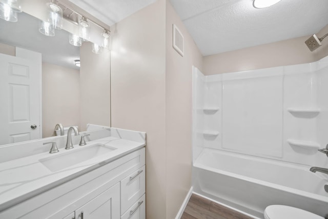 10620 Cady Rd, Jackson, MI 49201 - full bath featuring wood finished floors, vanity, shower / bathtub combination, and a textured ceiling