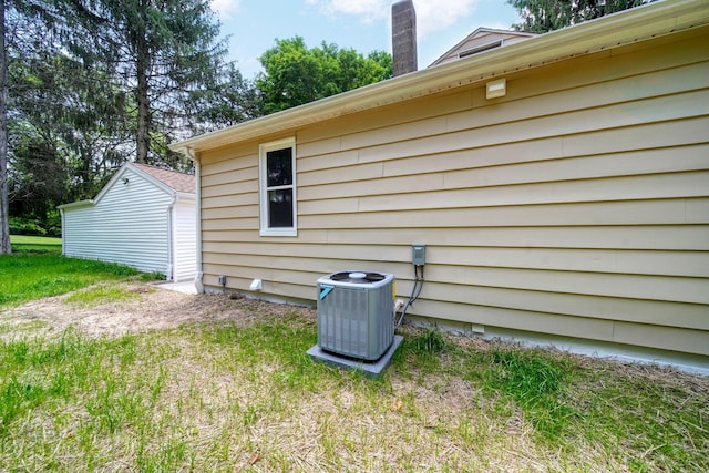 10620 Cady Rd, Jackson, MI 49201 - view of home's exterior featuring a central air condition unit and a chimney