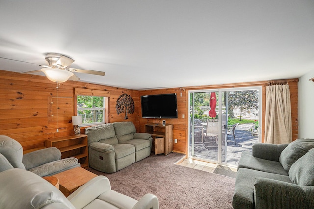 8828 Elm, Fremont, MI 49412 - living area featuring wood walls, carpet, and ceiling fan